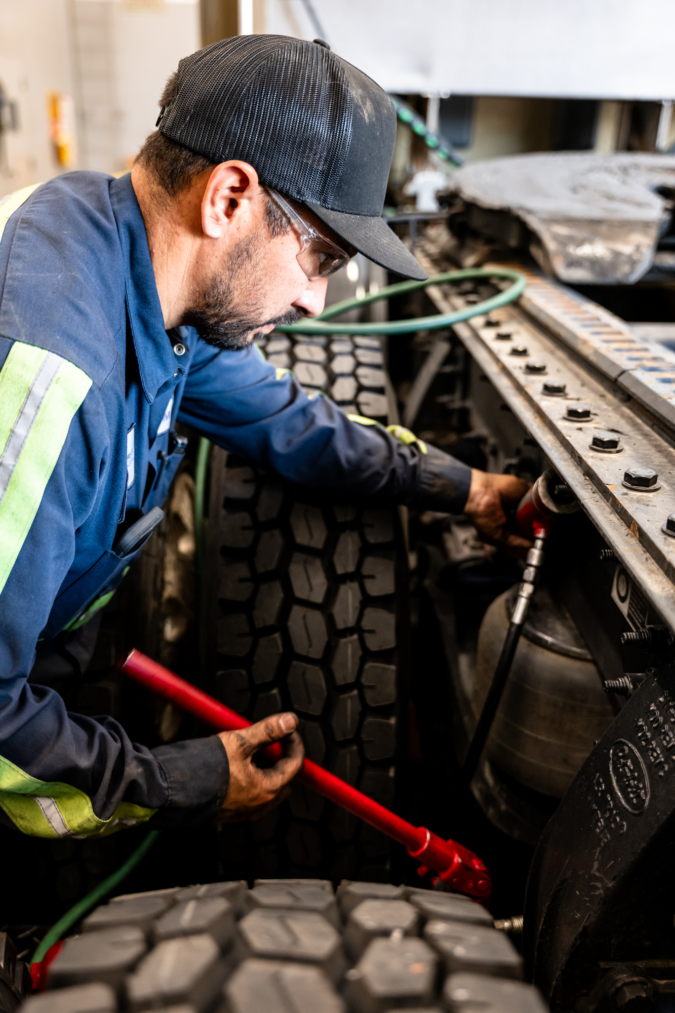 East Bay Tire employee servicing a vehicle
