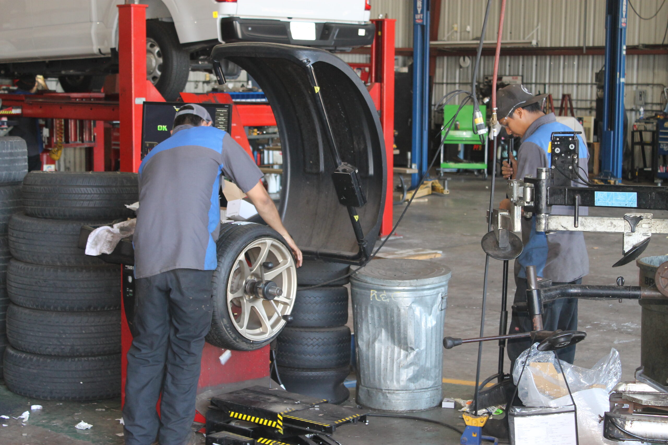 Employees balancing tires in a service center at Hilo, Hawaii
