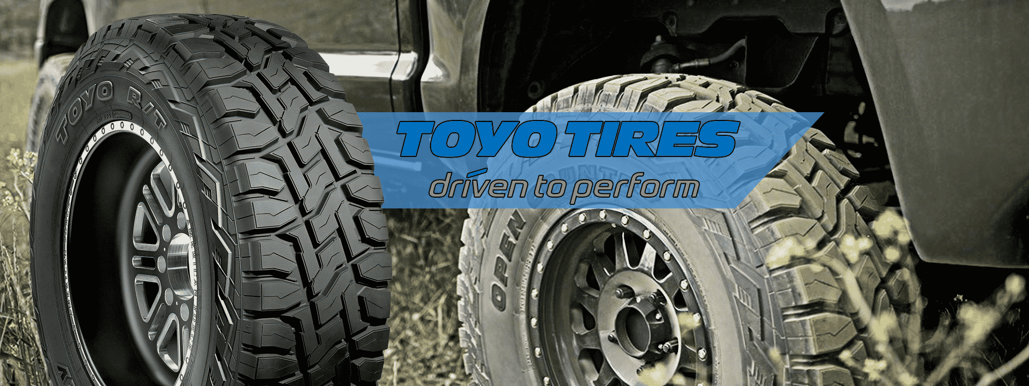 Two off-the-road-tires, one clean and one dirty, from East Bay Tire
